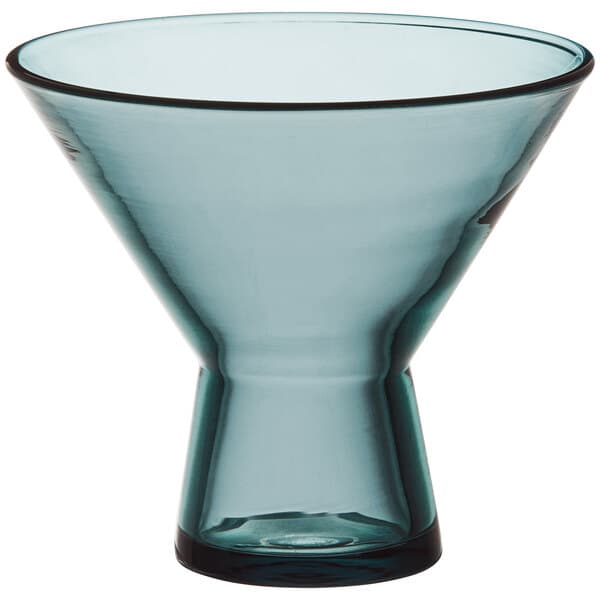 A close-up of a blue Acopa Pangea martini glass with a clear bottom and small rim.