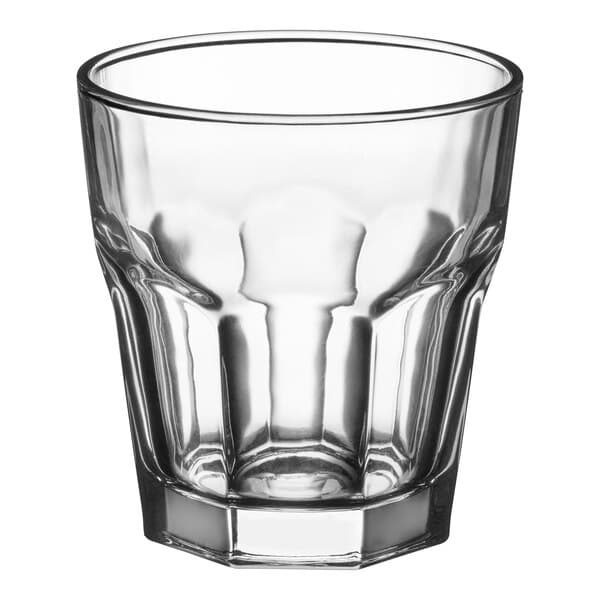An Acopa Memphis clear glass tumbler with a curved rim.