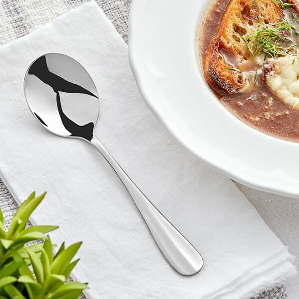 a spoon and bowl of soup