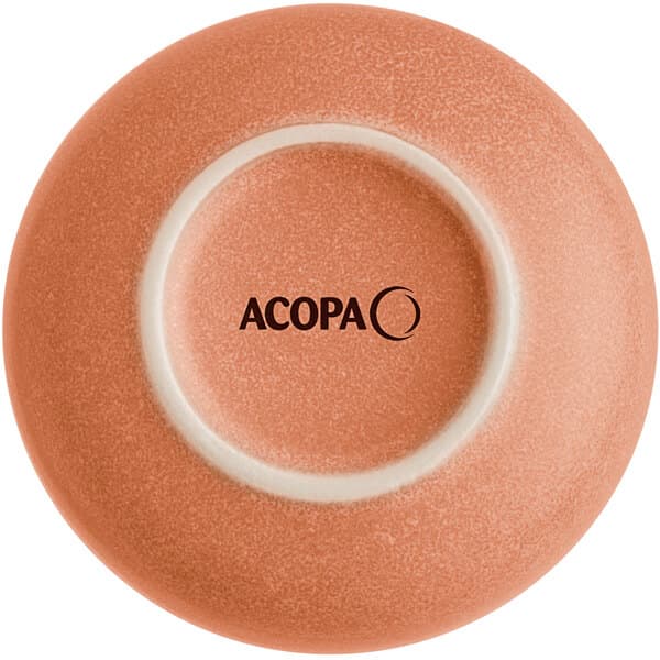 A close-up of an Acopa Terra Cotta ramekin with a white circle on the bottom.