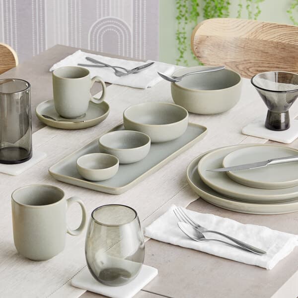 A white Acopa Pangea porcelain ramekin on a table.