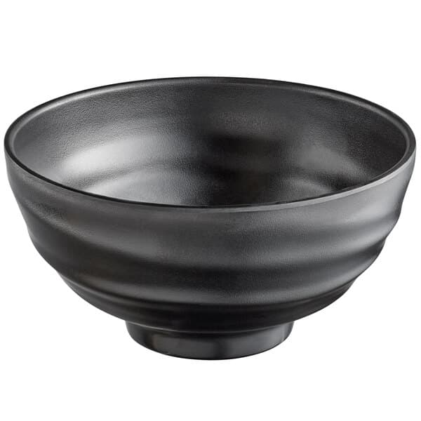 A pack of 12 matte black Acopa melamine bowls with a black rim.
