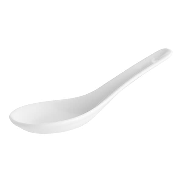 A close-up of an Acopa Bright White Ceramic Chinese Soup Spoon with a white handle.