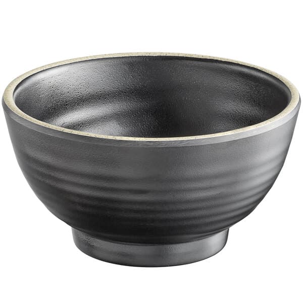 A black Acopa melamine bowl with an ivory rim.