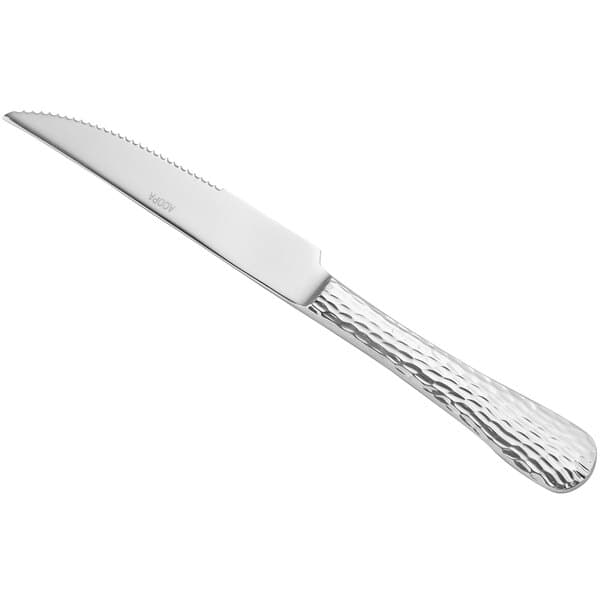 An Acopa Inspira stainless steel steak knife with a textured silver handle.