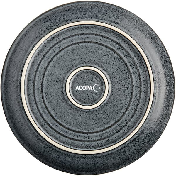 A midnight blue matte coupe stoneware plate with a white rim.