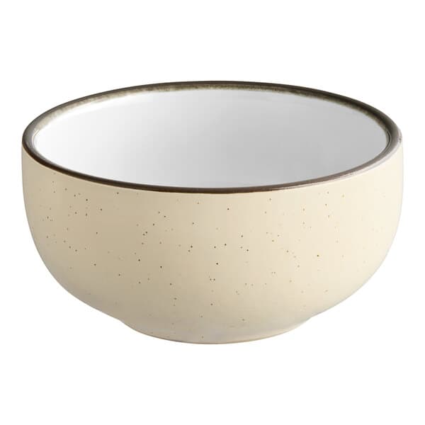 An Acopa Embers stoneware bowl in cream white with a black rim.