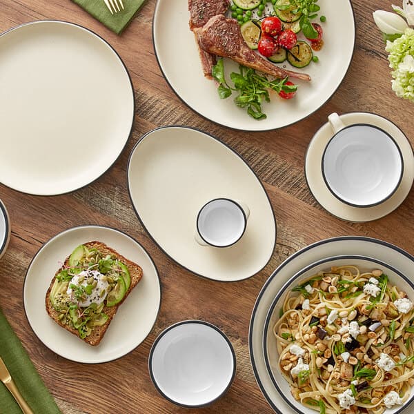 A table set with Acopa Embers stoneware plates, bowls, and utensils.