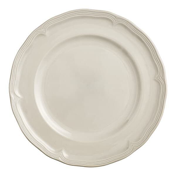 A white porcelain plate with a scalloped white rim.
