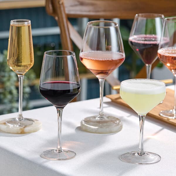 A group of Acopa Silhouette wine glasses on a table.