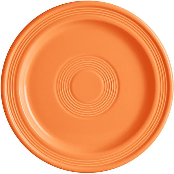 An Acopa Capri Valencia Orange stoneware plate with a circular pattern.