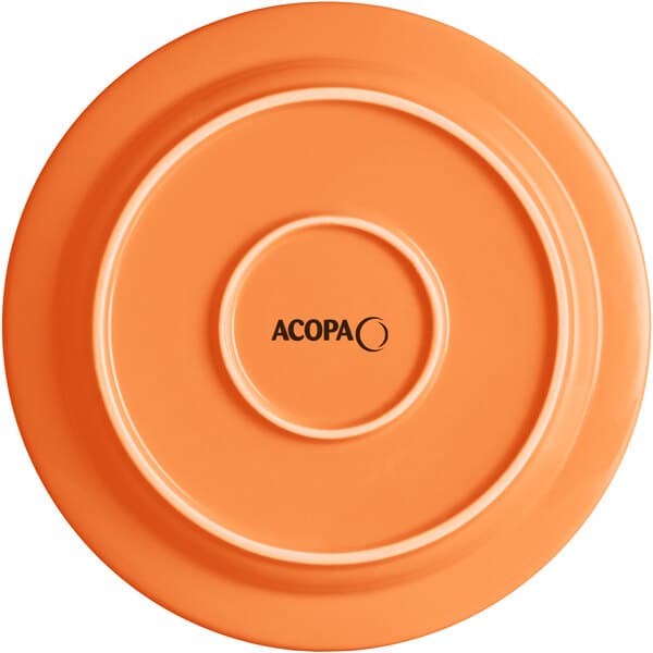 An orange Acopa Capri stoneware plate with black text that reads "Valencia"