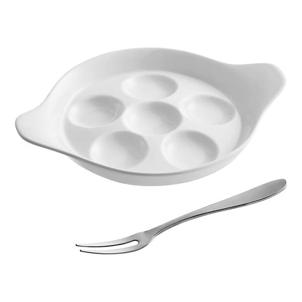 A white bowl with six holes next to a fork.