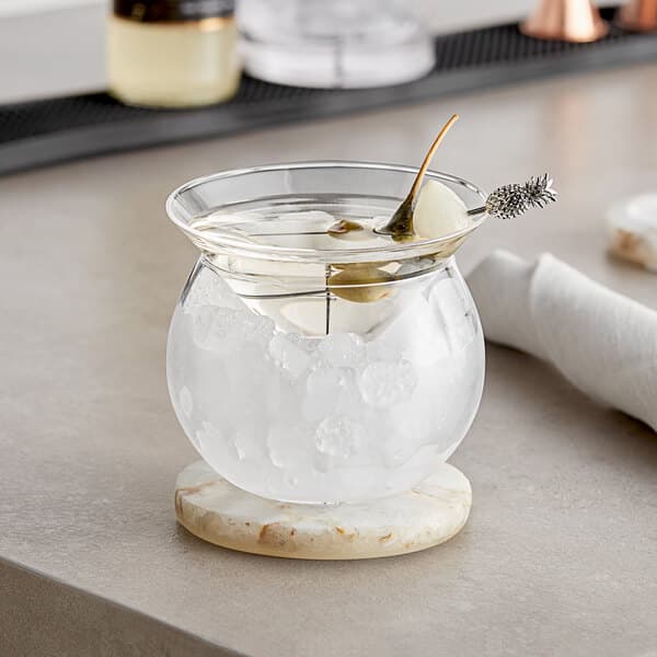An Acopa martini chiller filled with ice and a stem.