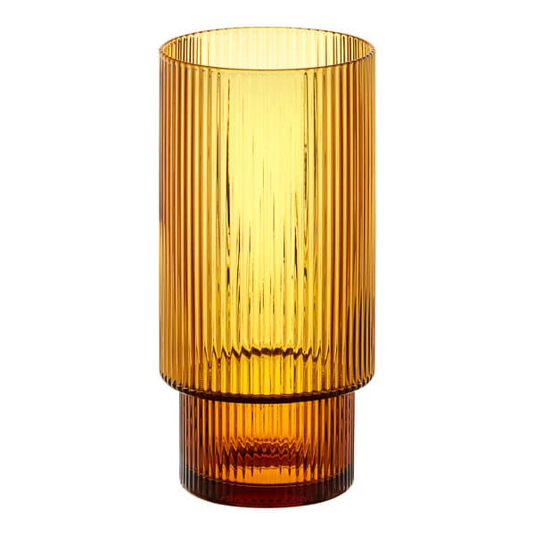 An Acopa Lore ribbed glass tealight/votive holder with a yellow base.