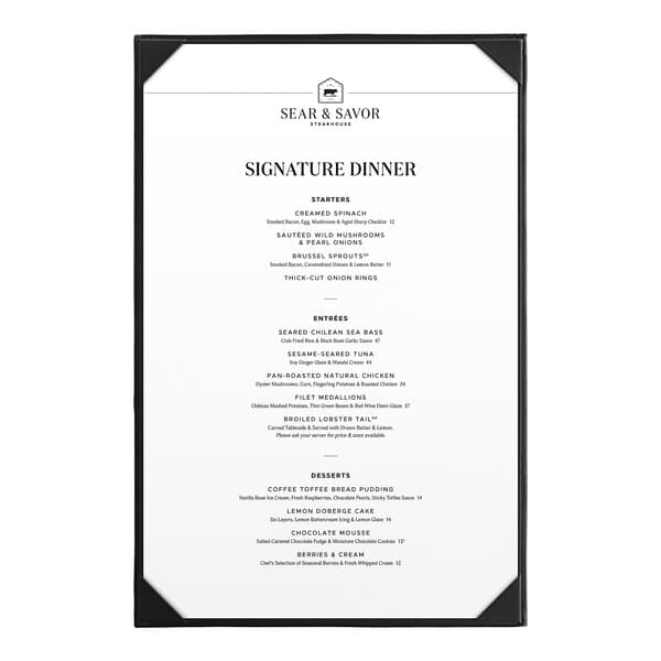 A black Acopa Prime vinyl menu board with white borders on a table in a farm-to-table restaurant.