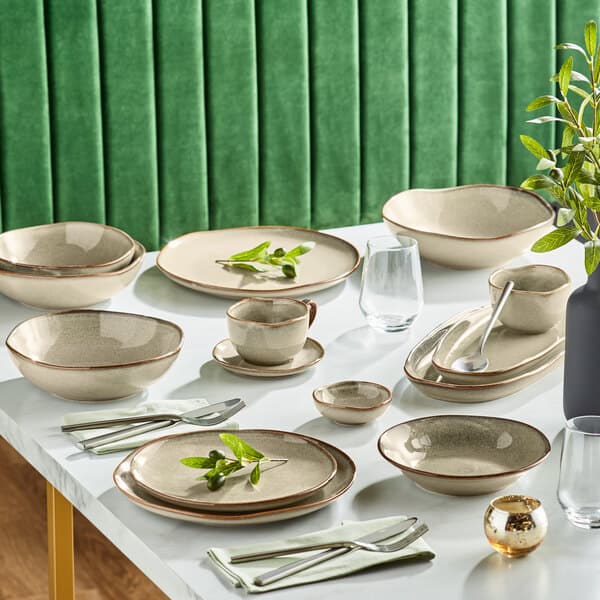 A table set with Acopa Highlands heather gray plates and bowls.