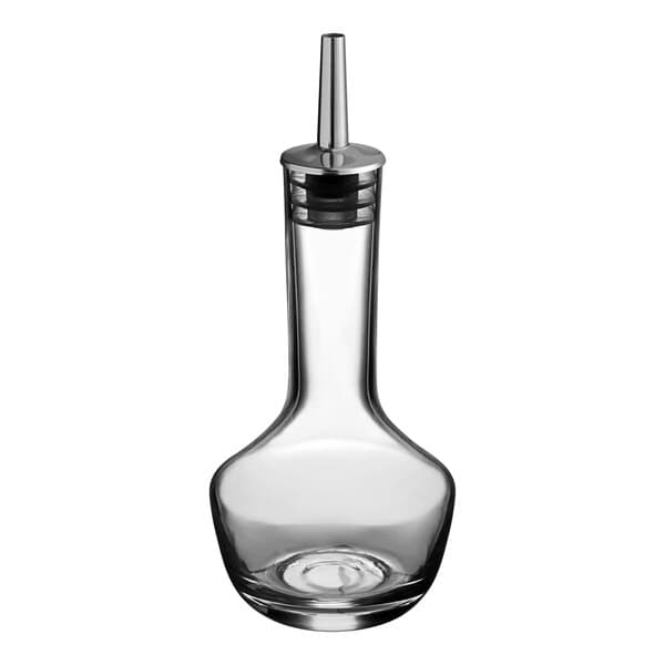 A clear glass Acopa bitters bottle with a metal top.