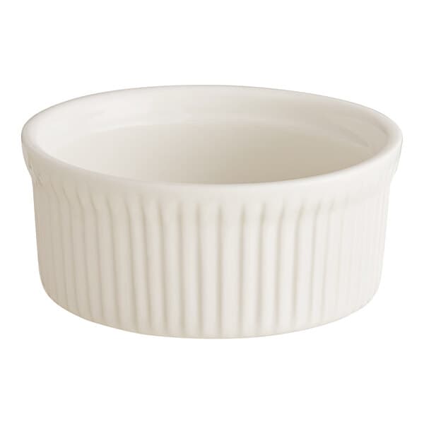 An Acopa ivory fluted porcelain souffle dish with a small rim.