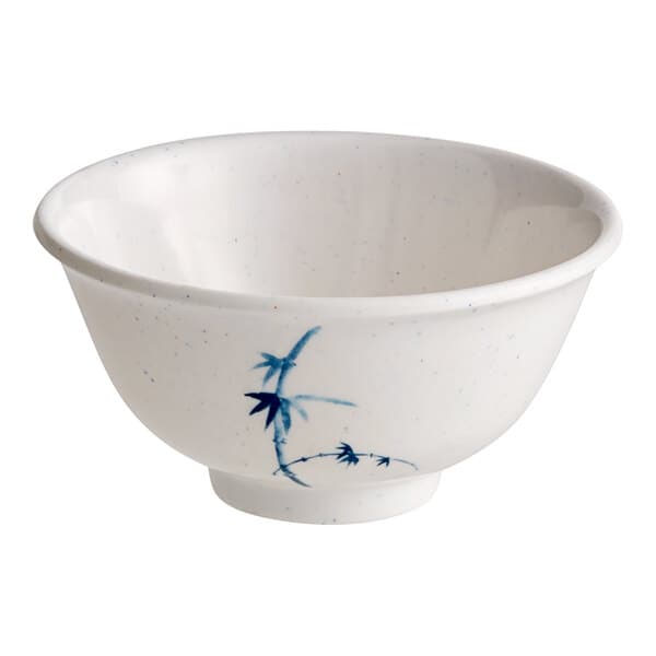 A white bowl with blue and white speckled designs.
