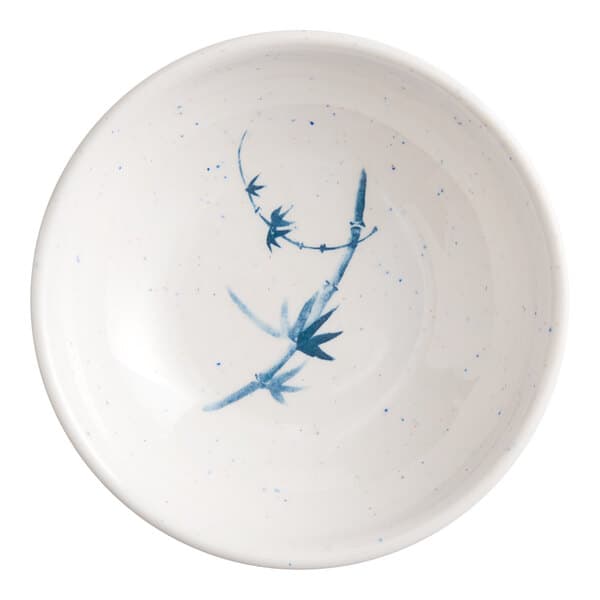 A white sauce dish with blue designs on it.