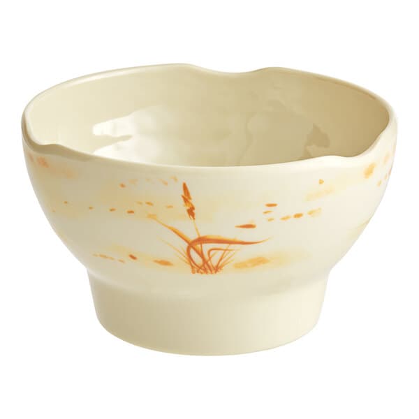 A beige Acopa melamine bowl with gold designs.