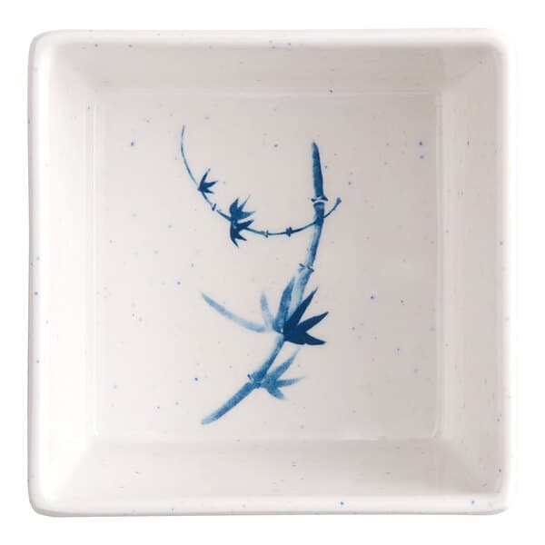 A white square bowl with blue painted bamboo.