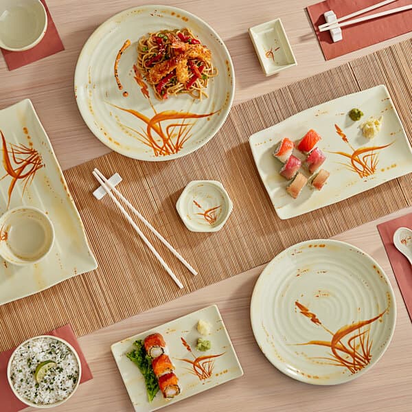 A table with white Acopa melamine bowls of food and chopsticks on it.