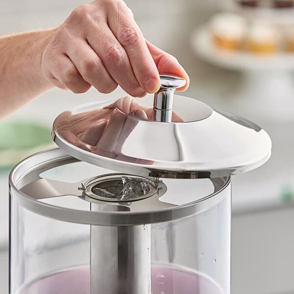 A stainless steel lid designed for an Acopa stainless steel and polycarbonate beverage dispenser.