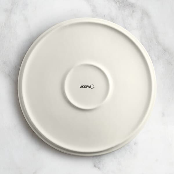 An Acopa Cape beige porcelain plate with black text that says "Oma" on it.