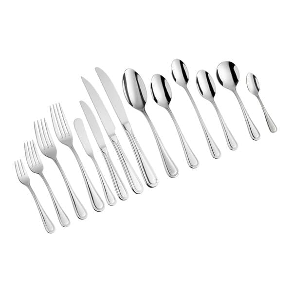An Acopa stainless steel table knife with a white background.