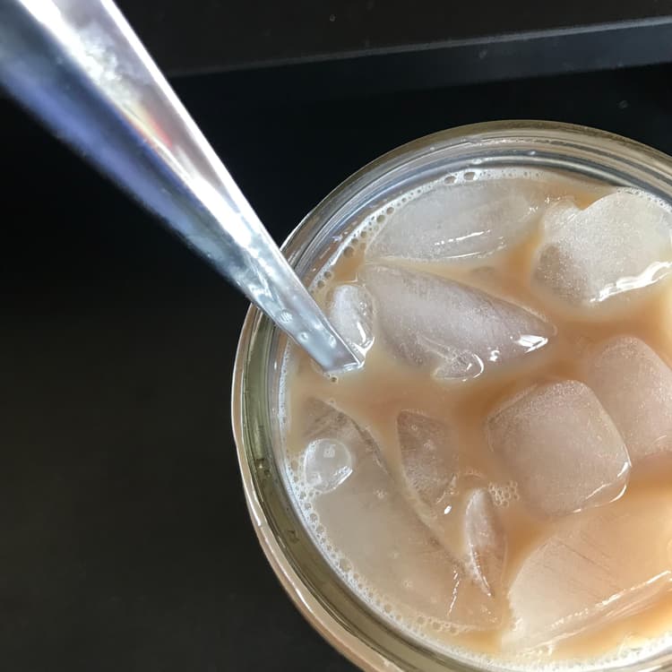 heavy weight iced tea spoons, being used to stir milk tea in the pic