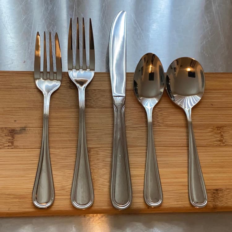 Front of the Sample - Acopa Edgeworth 18/8 Stainless Steel Heavy Weight Flatware Set with Service for One.