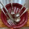 Picture of the Sample - Acopa Lydia 18/8 Stainless Steel Extra Heavy Weight Flatware Set with Service for One on a plate.