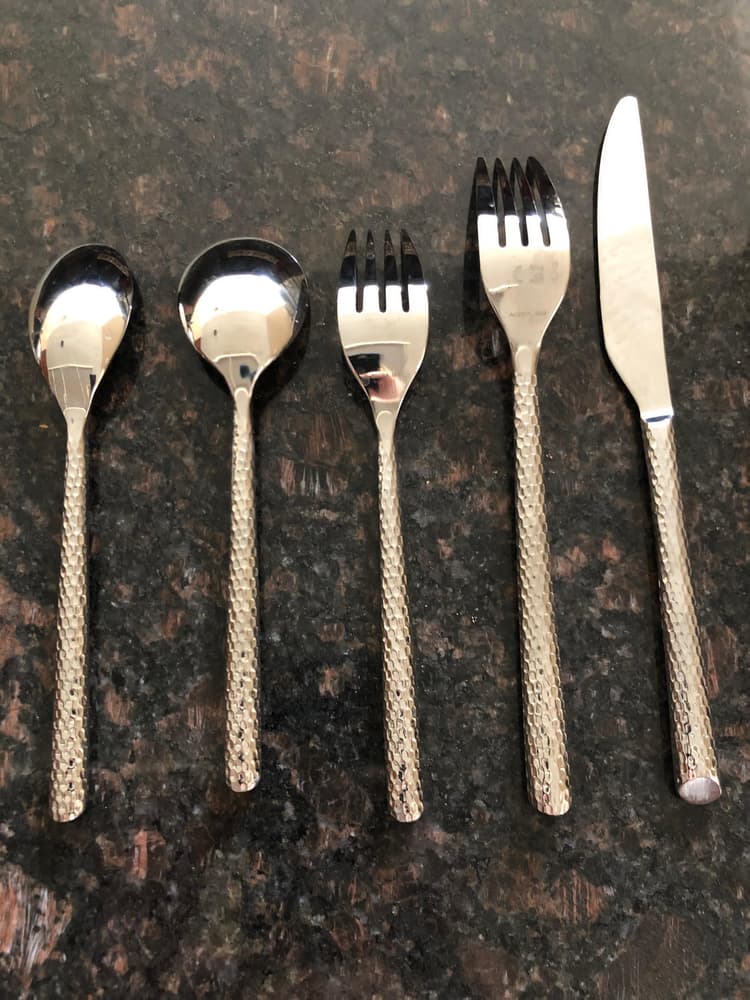 Beautiful set - substantial in weight. Design is on BOTH sides of the flatware.