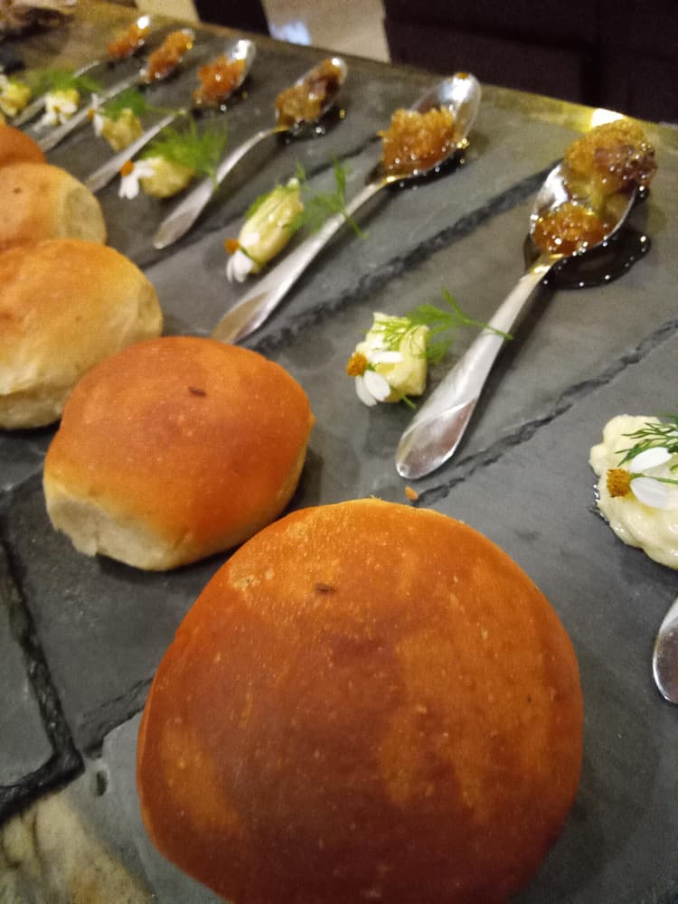 This a beautiful brioche roll with whipped honey butter and fresh dill.