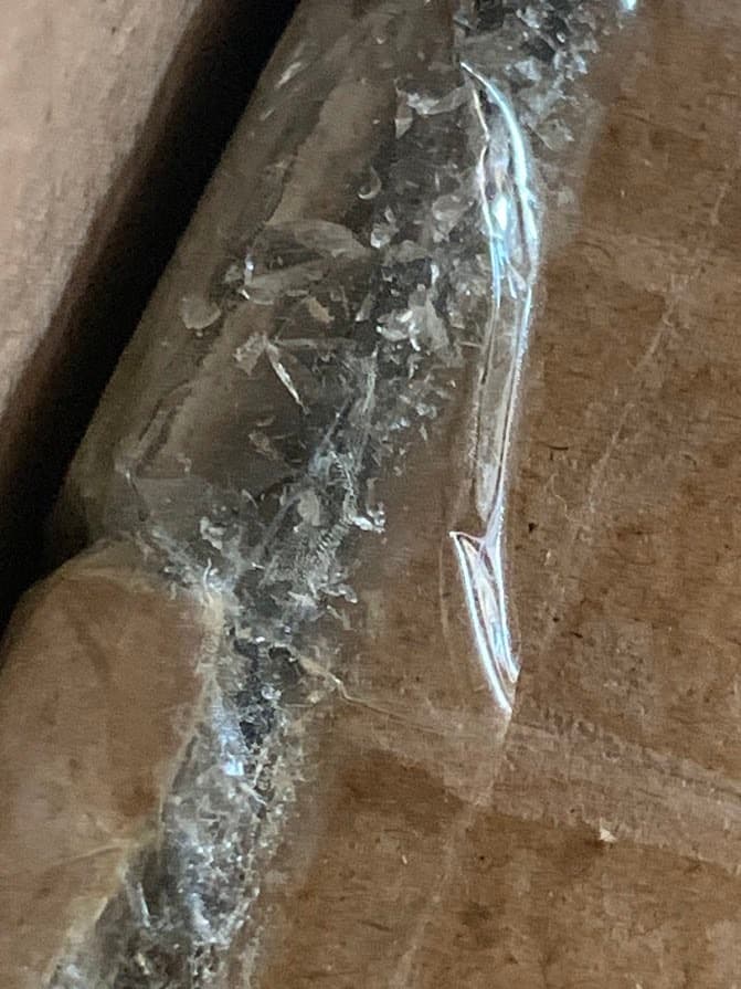 Glass shards in unopened box