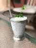 I was serving mint juleps in glass, and didn't know what I was missing by not using these steel cups. What I love the most is that I can put one of these in the freezer to chill and it gets ice cold much, much quicker than glass does! And the frost you see in this picture, which is part of the summery ritual, is much more prominent on metal than on glass. All the more reason to hold your mint julep cup by the base, as the tradition goes. Plenty of room for enough crushed ice in these 16-ouncers. People call the drink a Mint Julep; I call it a Bourbon Mint Slushy. Down the hatch. We'll be making a lot more of these now that we have the proper cups. Our mint is in its prime but won't last forever. Now's the time!