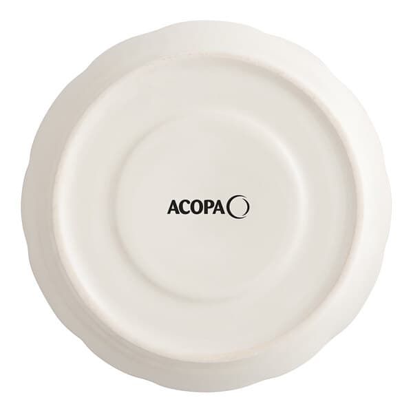 An ivory Acopa stoneware saucer with a scalloped edge and black text reading "Acopa" on it.