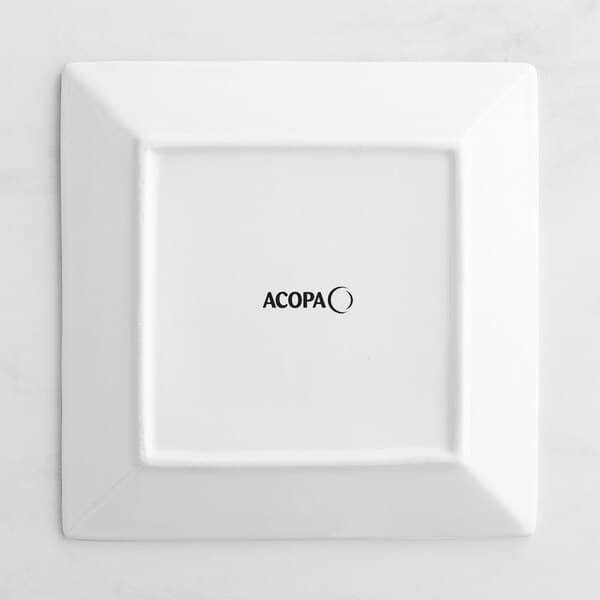 An Acopa Bright White square porcelain plate with black text that says Mocca.
