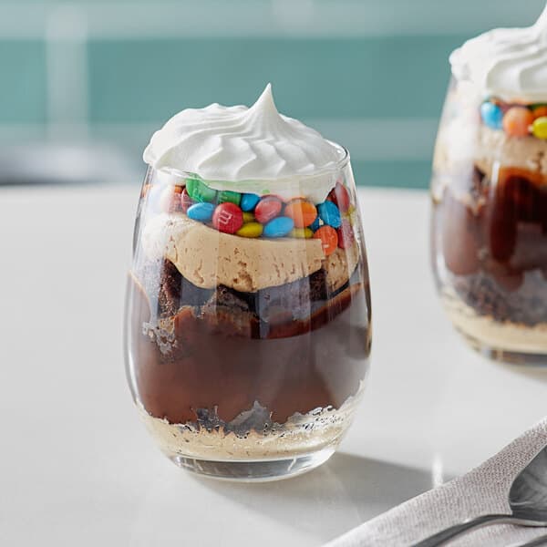 A dessert in an Acopa narrow stemless wine glass with chocolate, marshmallow, and candy.