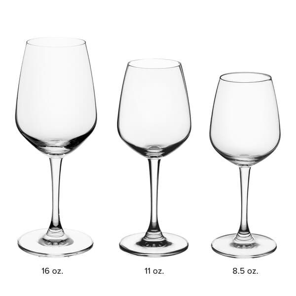 A close-up of three Acopa Radiance wine glasses with measurements on them.