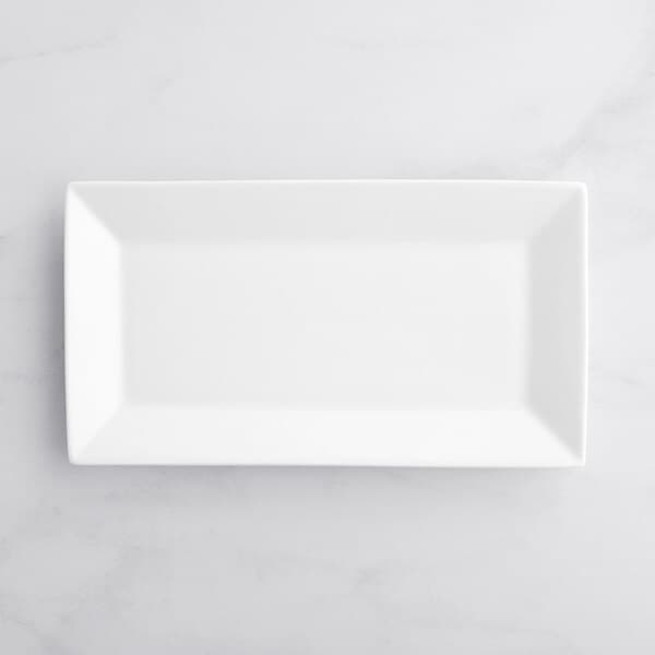 A white rectangular Acopa porcelain platter on a white surface.
