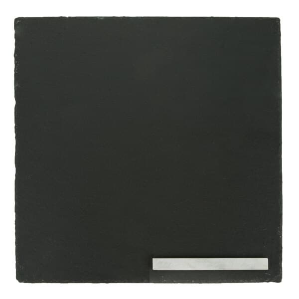 A black square slate tray with soapstone chalk.