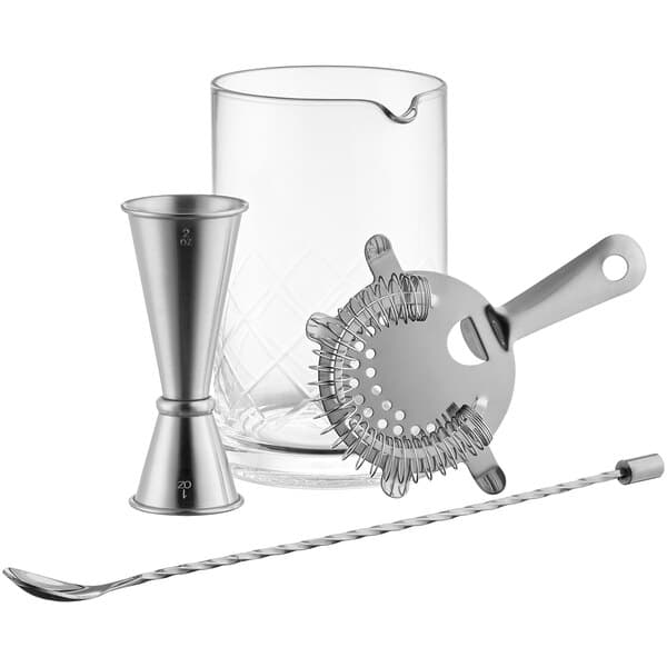 An Acopa cocktail stirring glass, strainer, and silver spoon set.