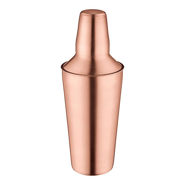An Acopa copper cobbler cocktail shaker with a cap on.