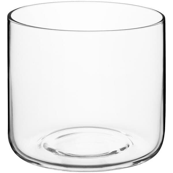 A clear glass Acopa Spanish Style double rocks glass with a round bottom.