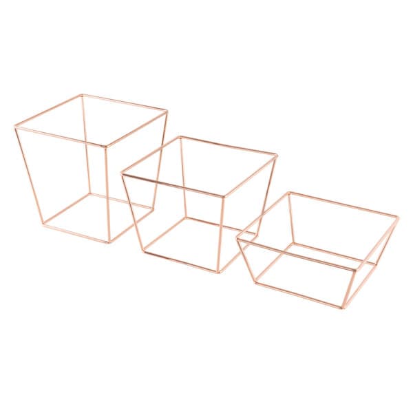 A set of three rose gold metal display stands with a wire frame on a white background.