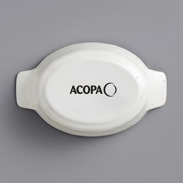 A white stoneware dish with black text reading "Acopa" on it.