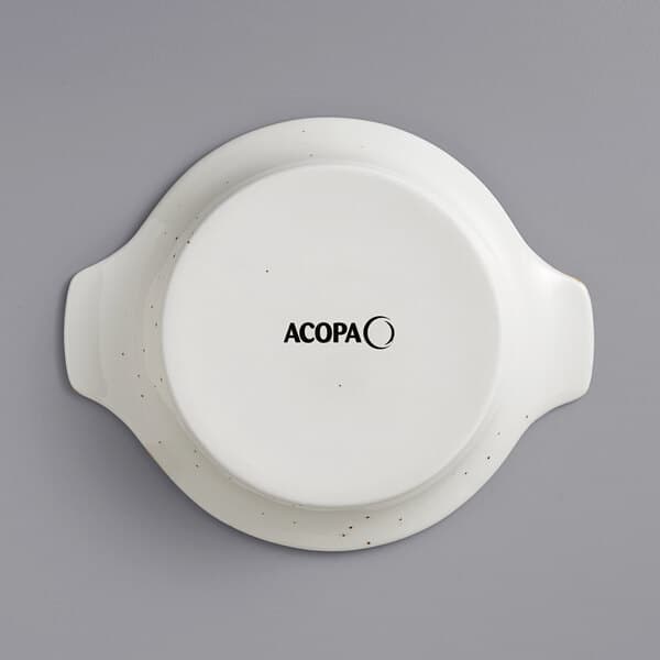 An Acopa vanilla bean stoneware shirred egg casserole dish with the word Acopa in black text.